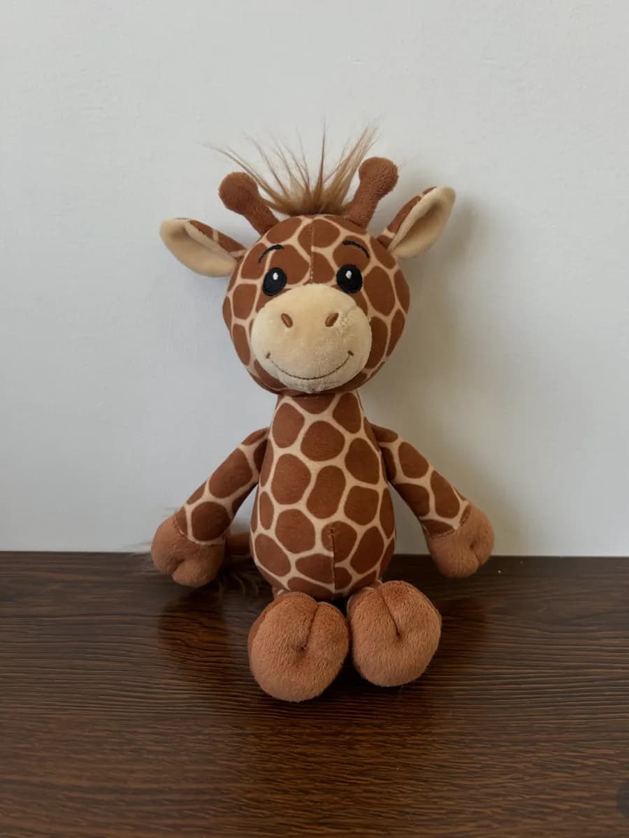 Custom giraffe stuffed animal with a printed spot pattern and tufted mane