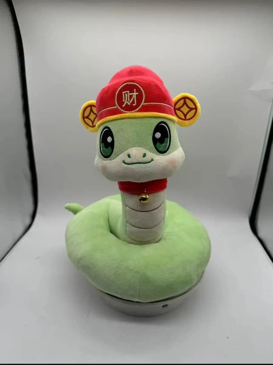 Snake plush toy with a gold coin appliqué for a lunar new year range