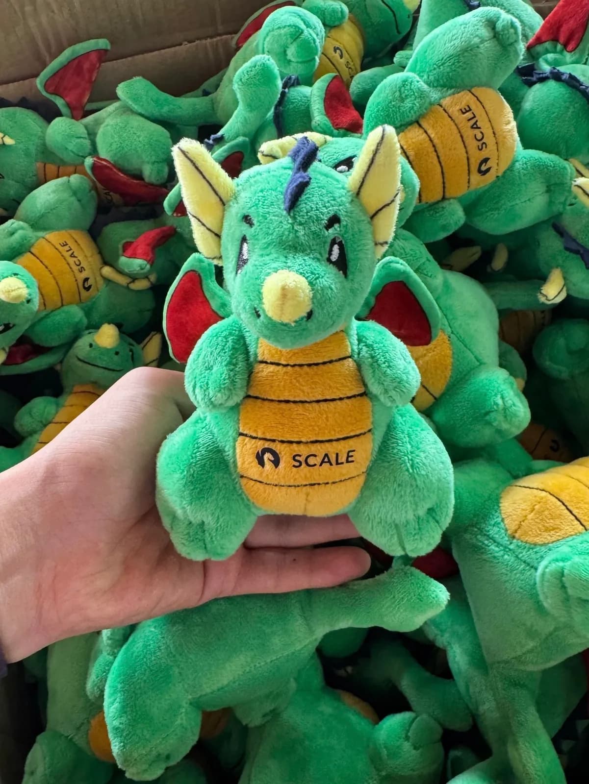Handful of finished promotional plush toys straight off the line