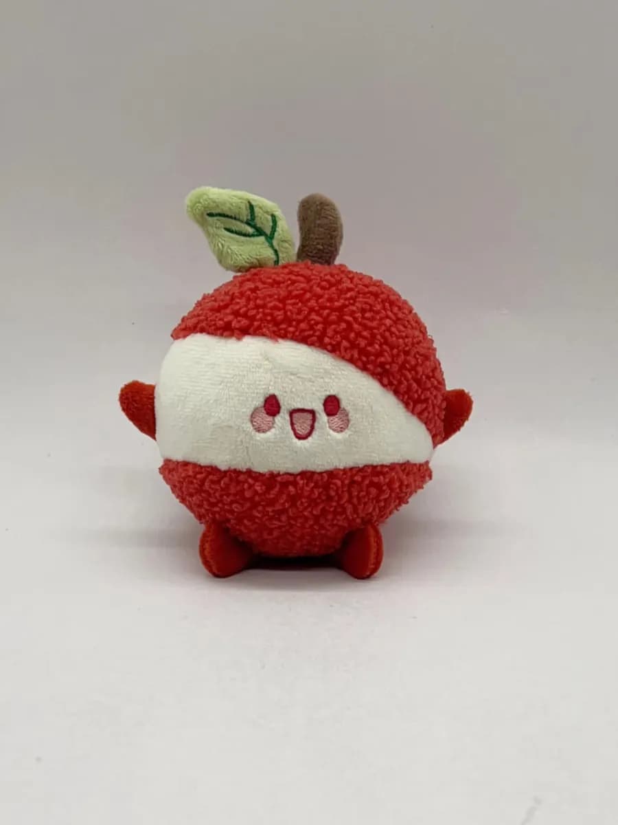 Red apple character plush toy with a fabric leaf