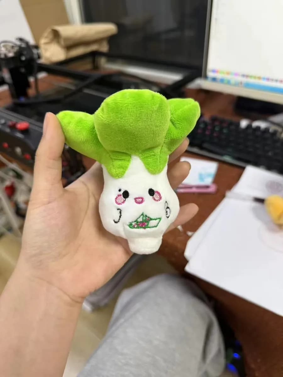 Leafy vegetable character plush toy with a printed face