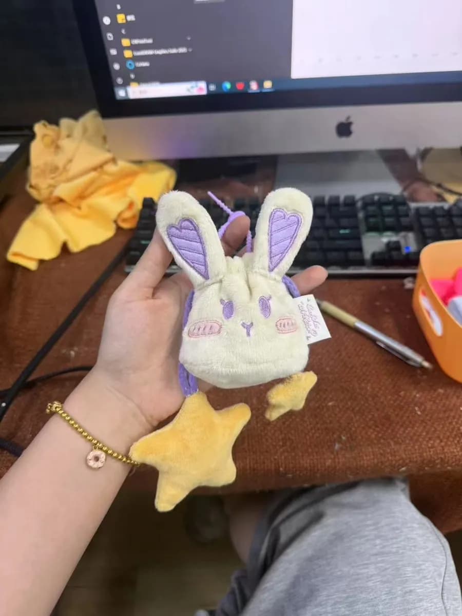 White rabbit plush keychain with embroidered face and metal clip