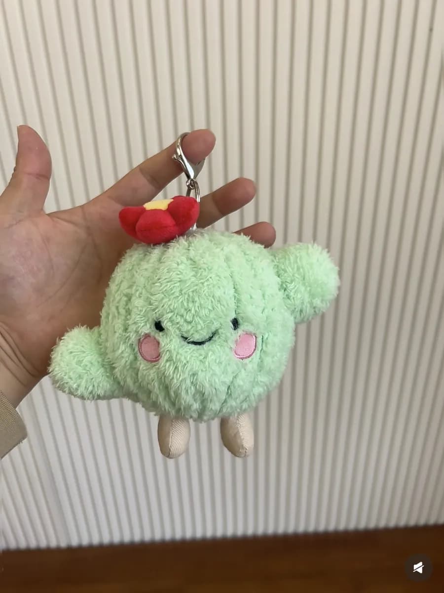 Mint green cloud plush charm with embroidered blush cheeks