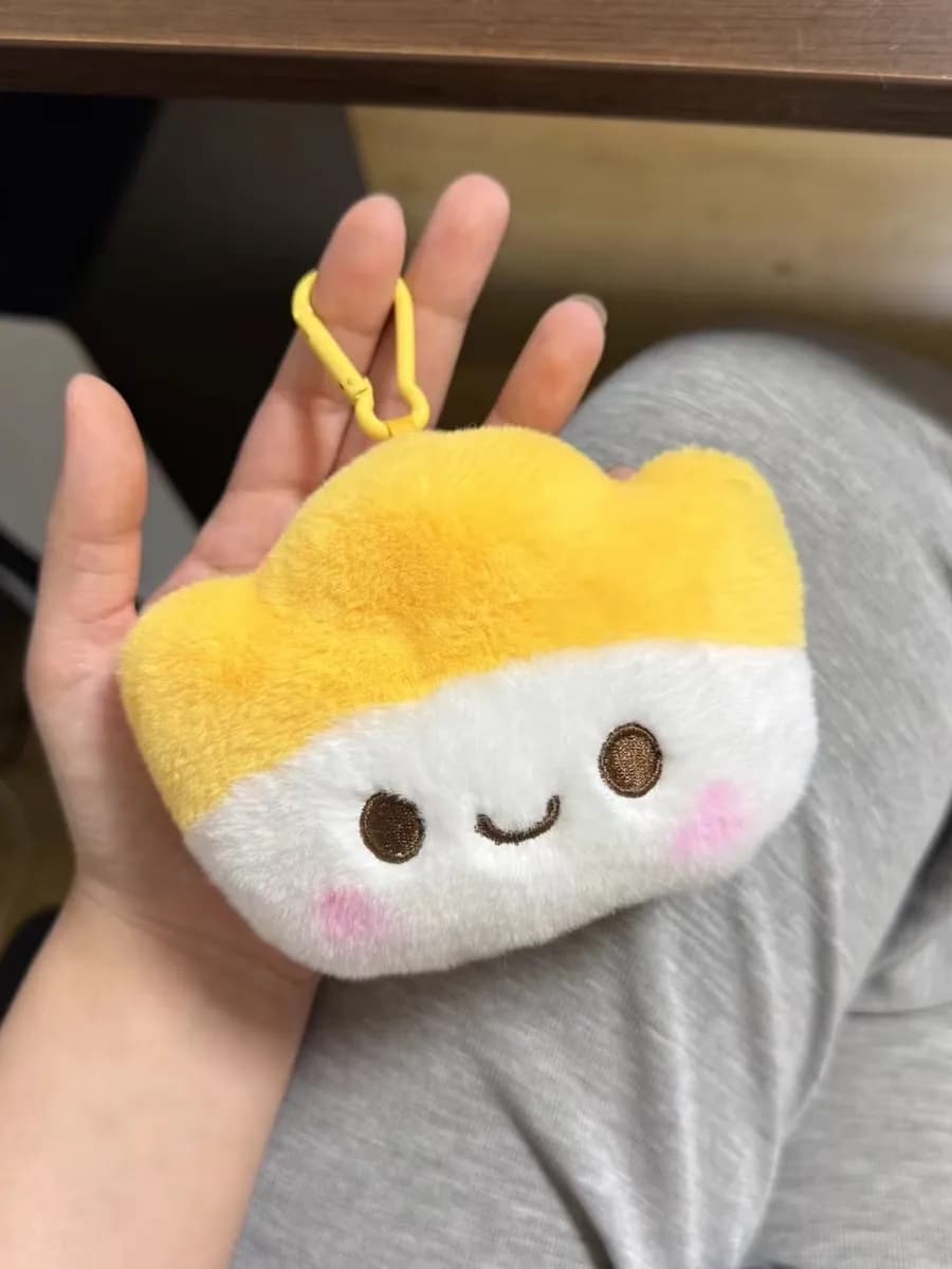 Rice ball plush keychain with embroidered smiling face