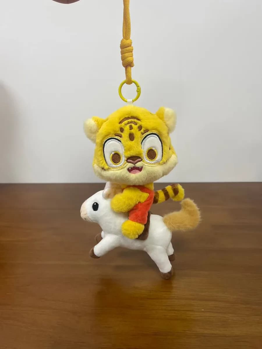 Custom tiger plush keychain in yellow and gold on a lobster clasp