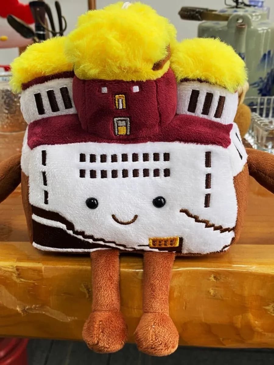 Large castle landmark plush souvenir with appliqué stonework