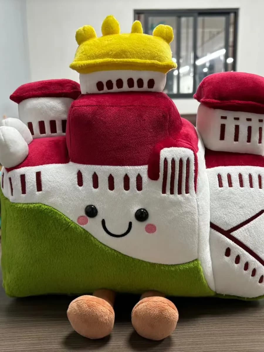 Pair of castle landmark plush souvenirs for a museum gift shop